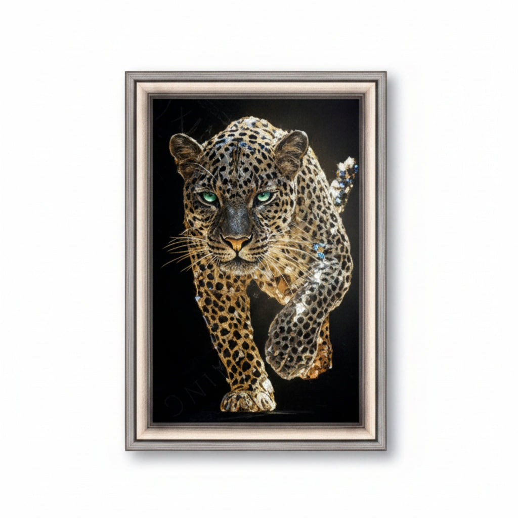 A framed art print depicting a detailed leopard with green eyes on a black background, enclosed in a silver and beige frame.