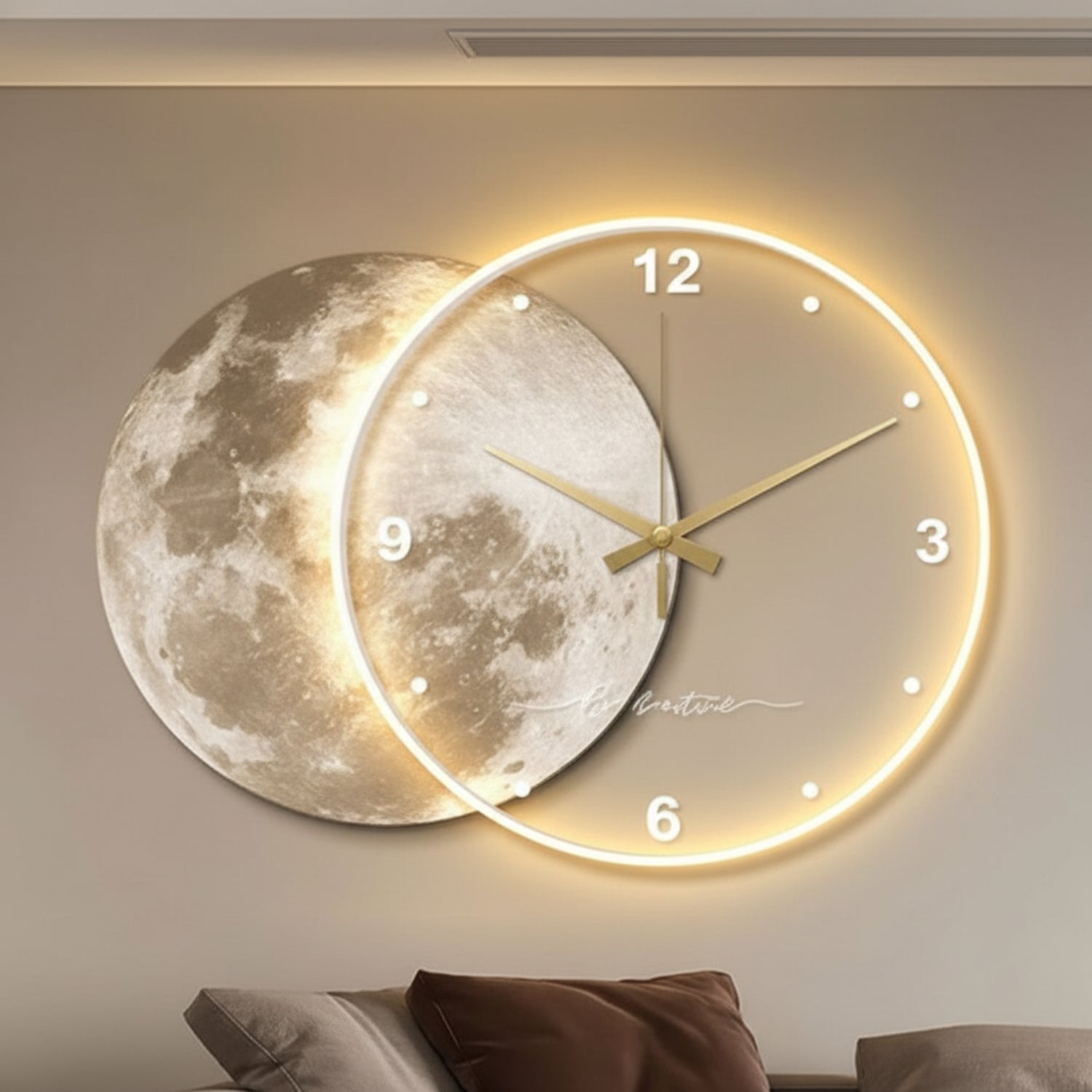 A modern wall clock featuring a large moon face behind a glowing circular clock dial with gold hands and white numerals, mounted on a beige wall above a sofa.