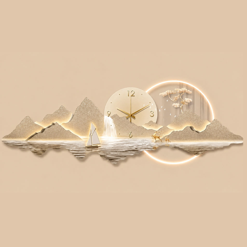 A decorative wall clock styled as a mountain and lake landscape with a glowing circular moon and sun motif. The clock face is cream with gold hands and numerals, set against a matching beige background.