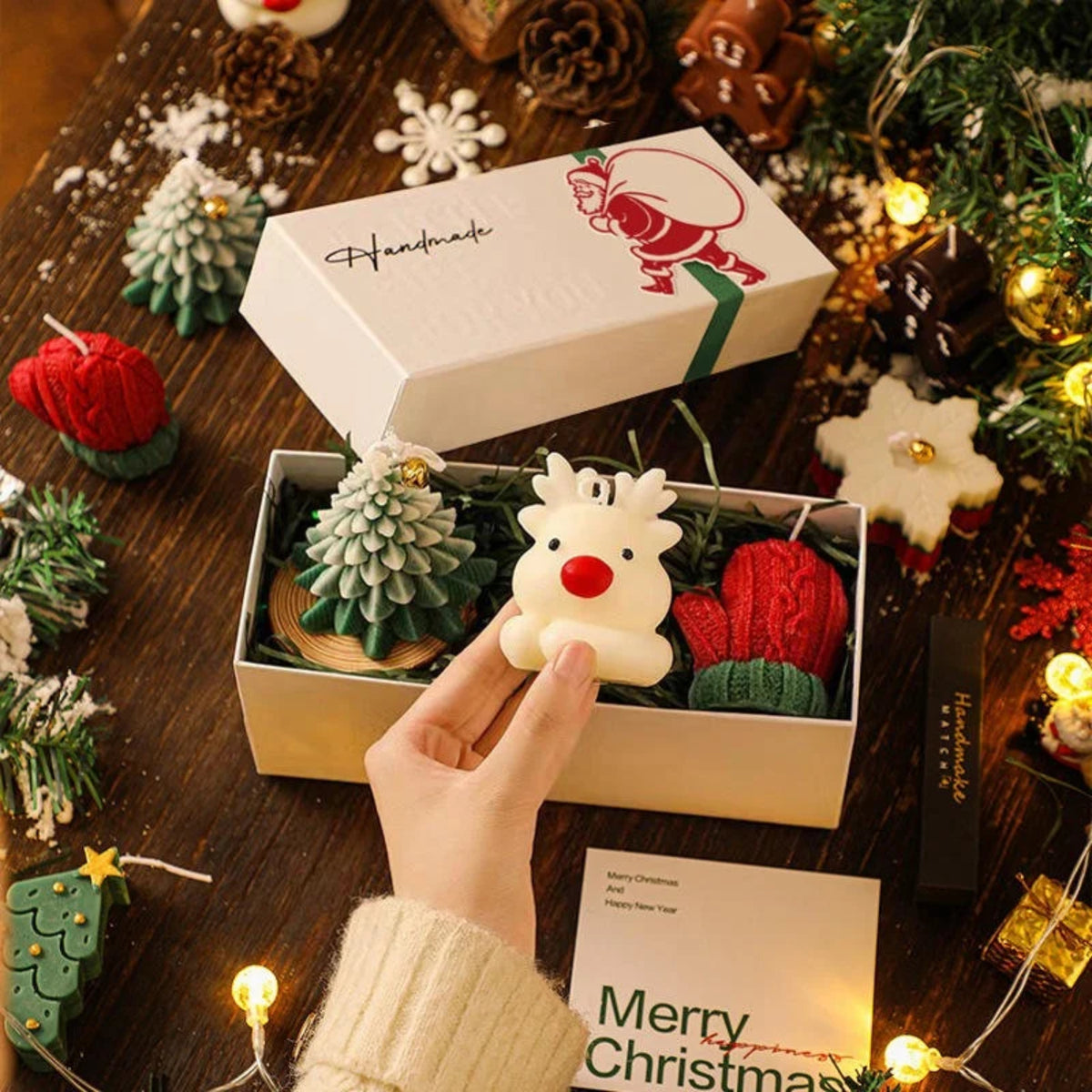 Handmade Christmas ornament set in a box with decorative items on a wooden table.