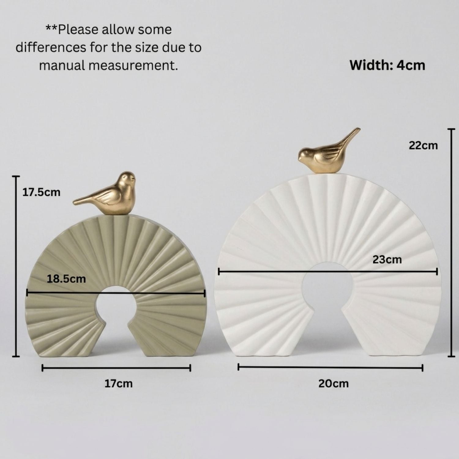 Two decorative shell-shaped ornaments with small bird toppers are shown on a light gray background with overlaid dimension labels and text noting manual measurement differences. One ornament is warm beige/taupe and the other is white.