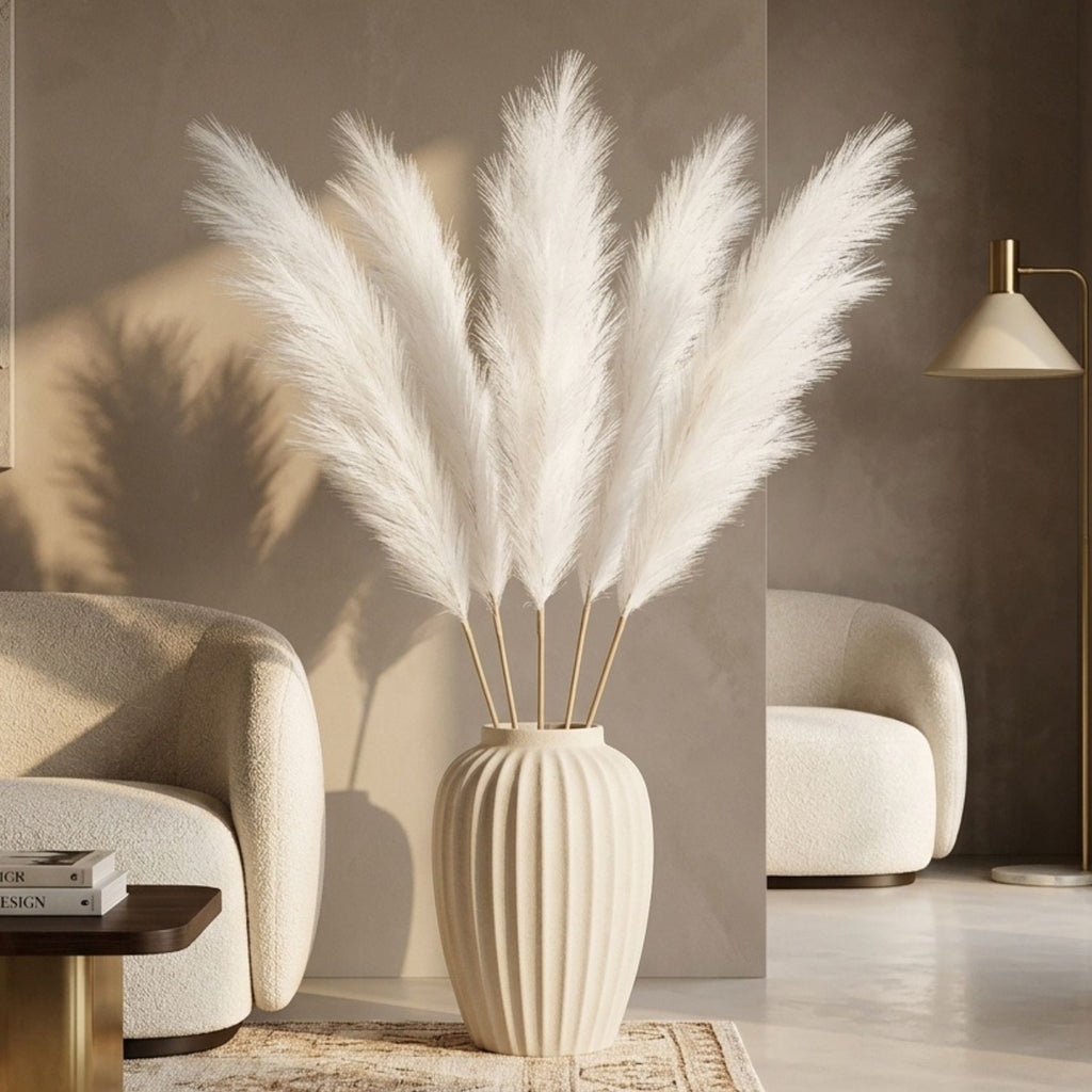White pampas grass stems in ribbed cream floor vase in neutral living room