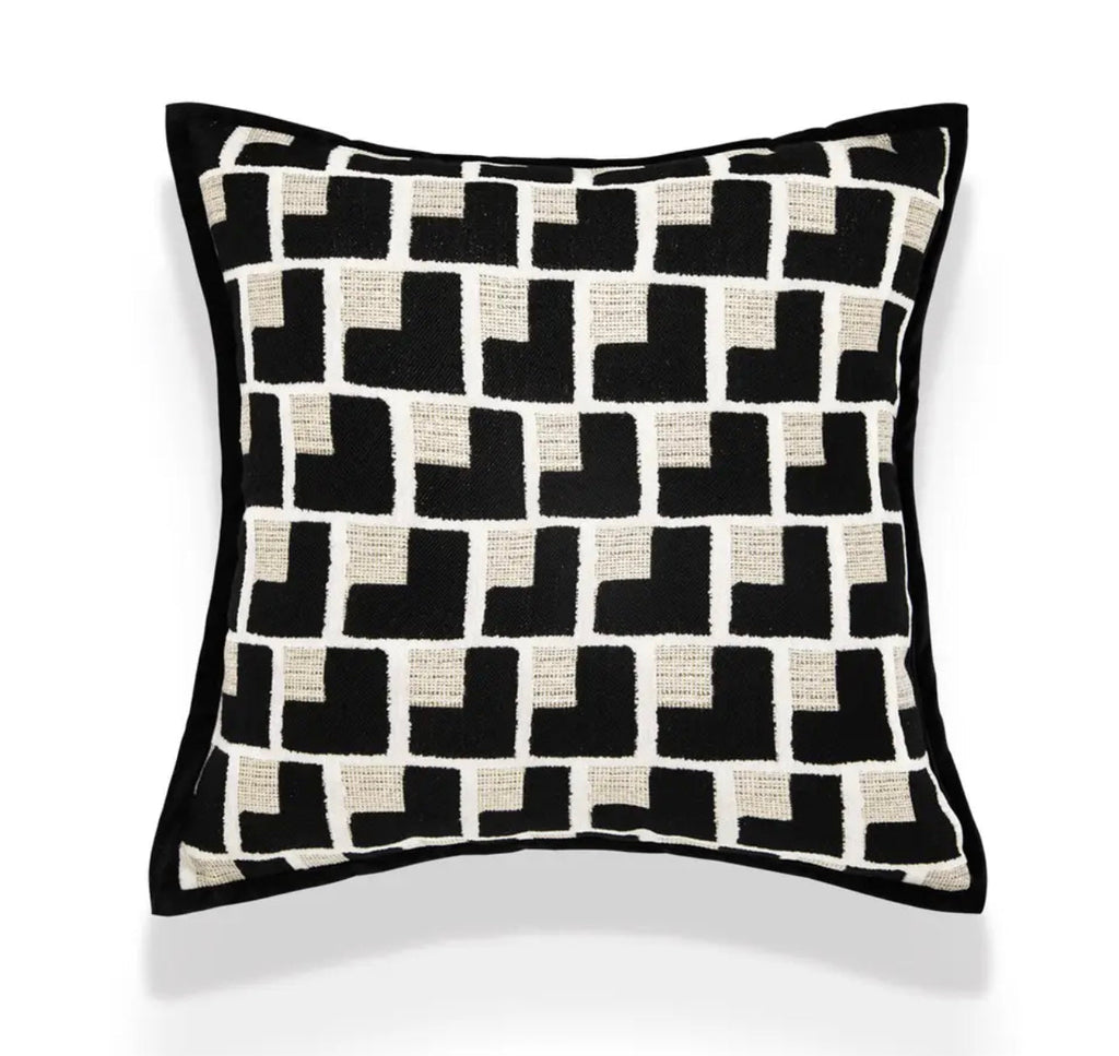 Close-up of the black and cream geometric cushion pattern and textured fabric