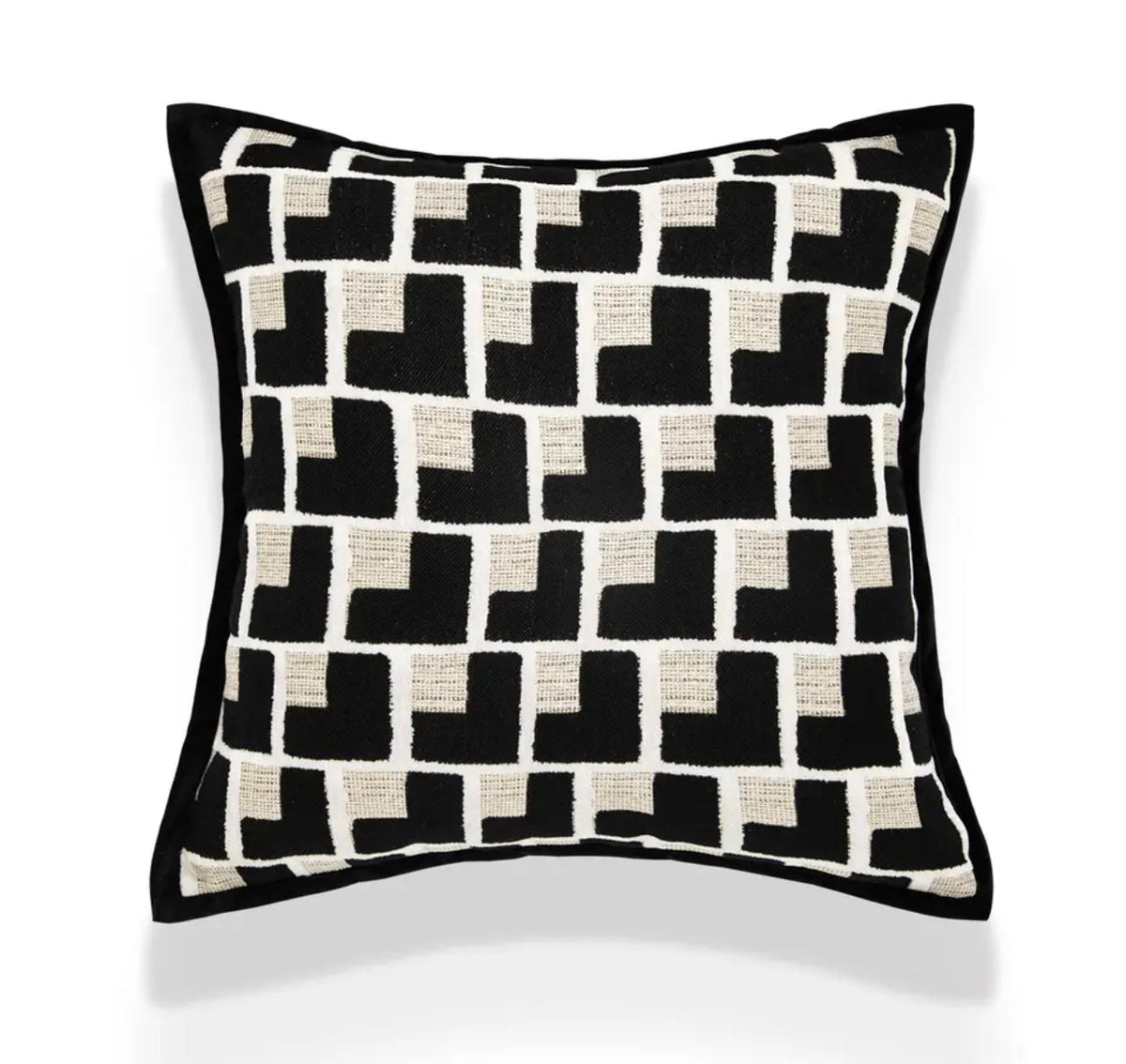 Close-up of the black and cream geometric cushion pattern and textured fabric