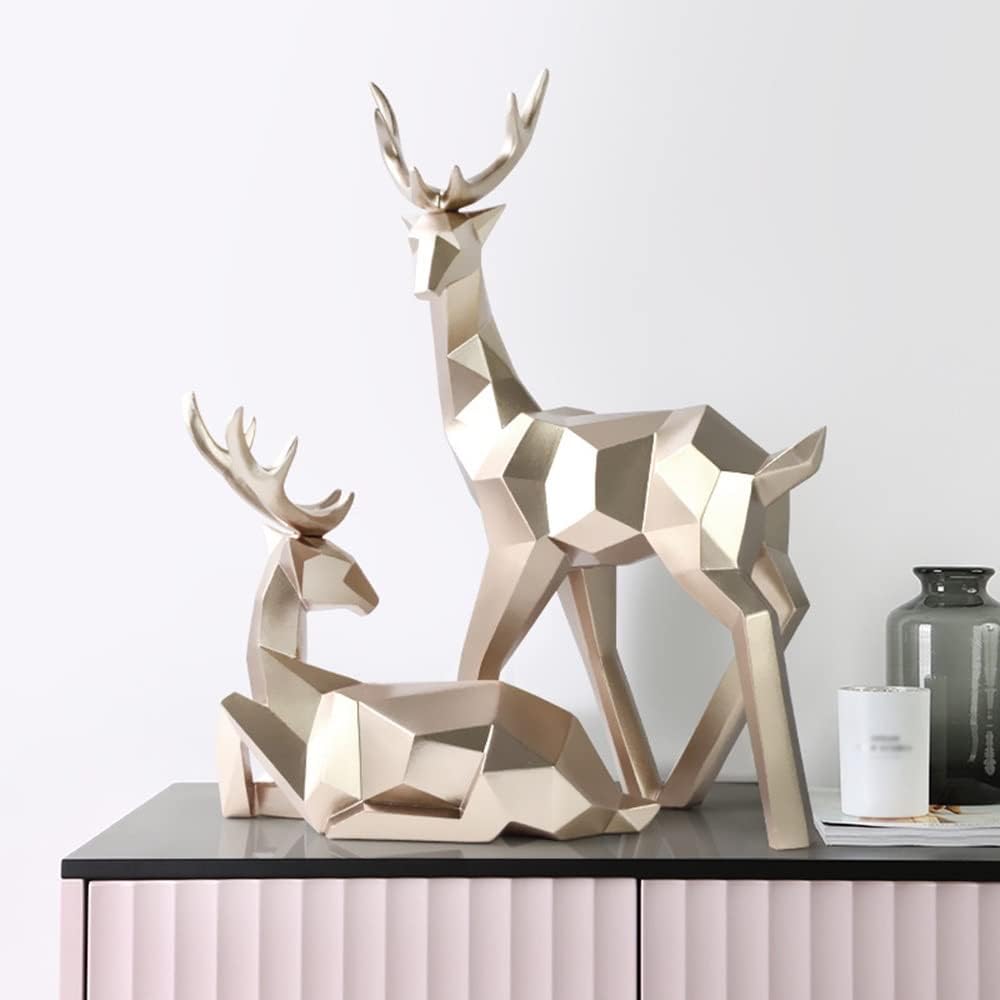 Geometric gold deer sculpture set of 2 - standing stag and resting fawn on grey sideboard