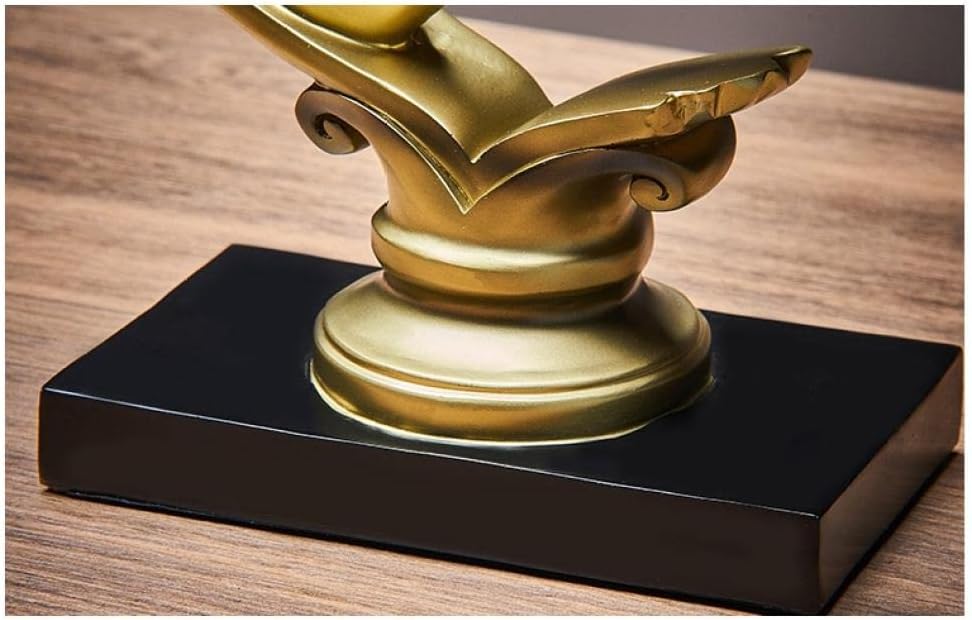 Gold holding hands heart sculpture - base detail showing ornate scrolled column on matte black rectangular base