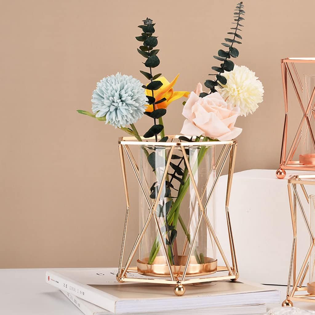 Rose gold geometric wire vase with flowers on coffee table books