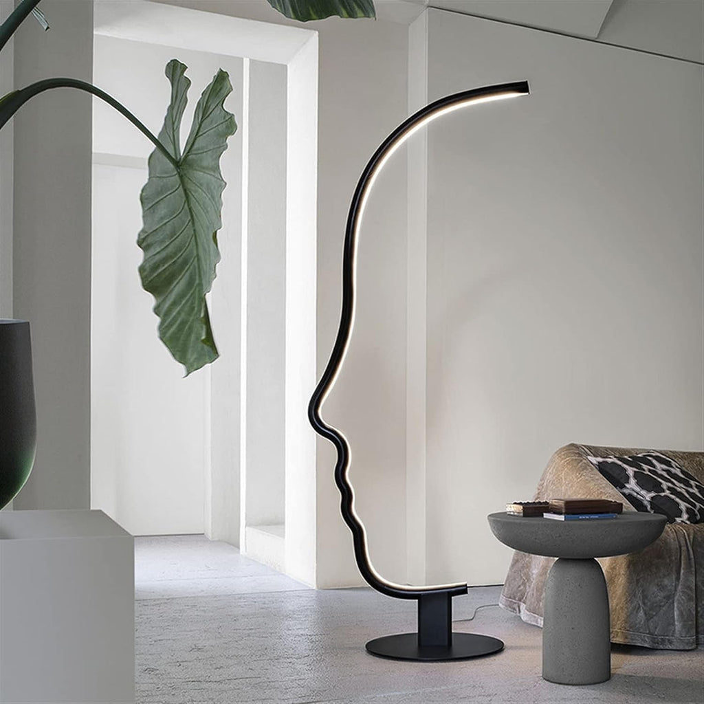 Abstract human face LED floor lamp styled in modern living room