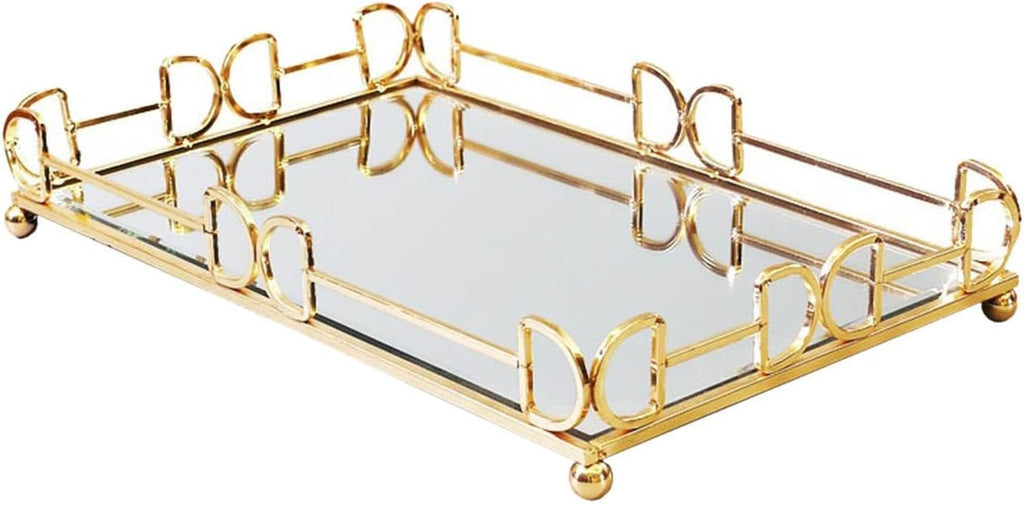 Gold mirror rectangular tray styled with candle holders and deer ornament on sideboard