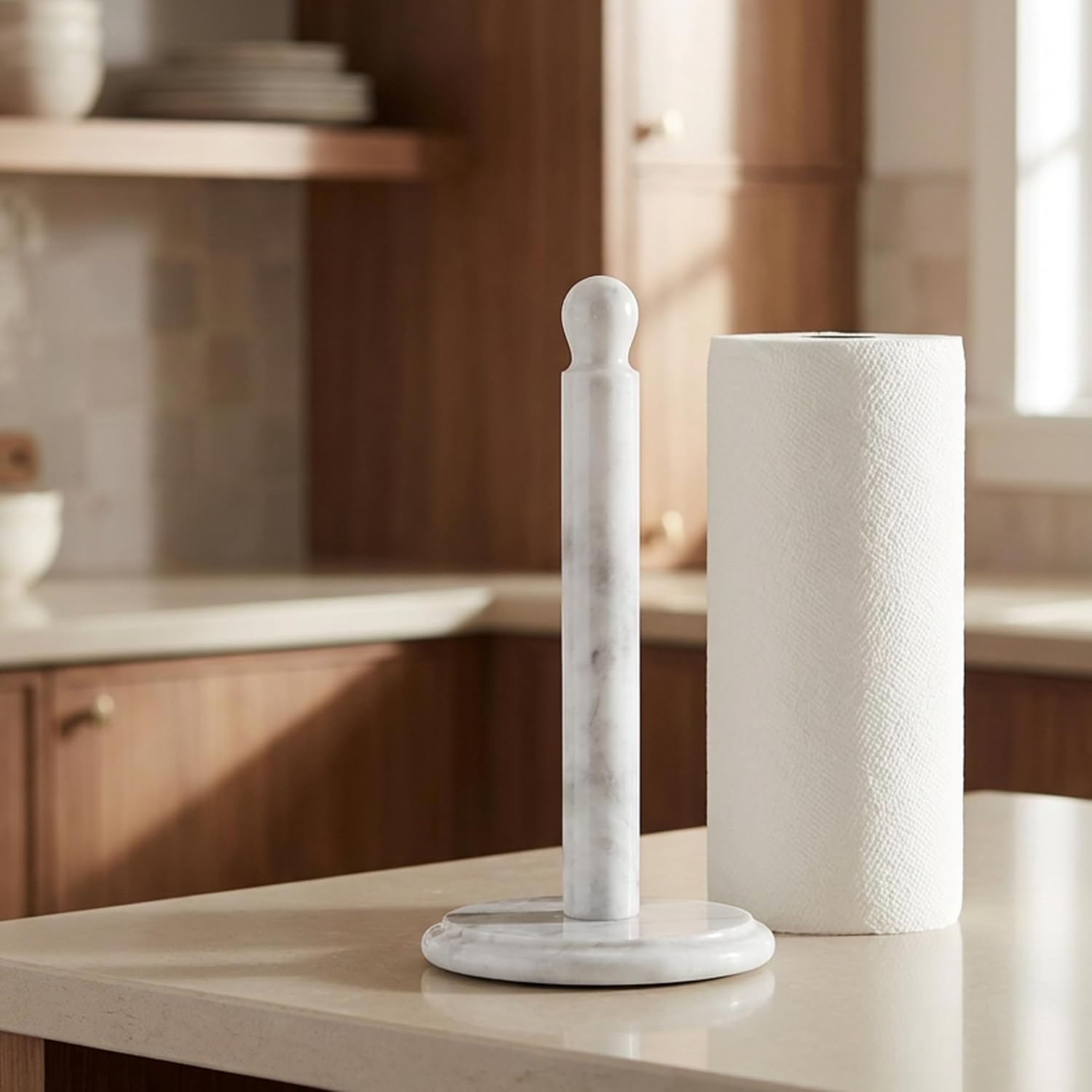 White marble paper towel holder next to kitchen roll on counter