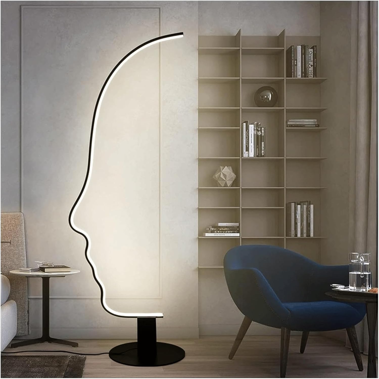 Abstract human face LED floor lamp in living room with bookshelf