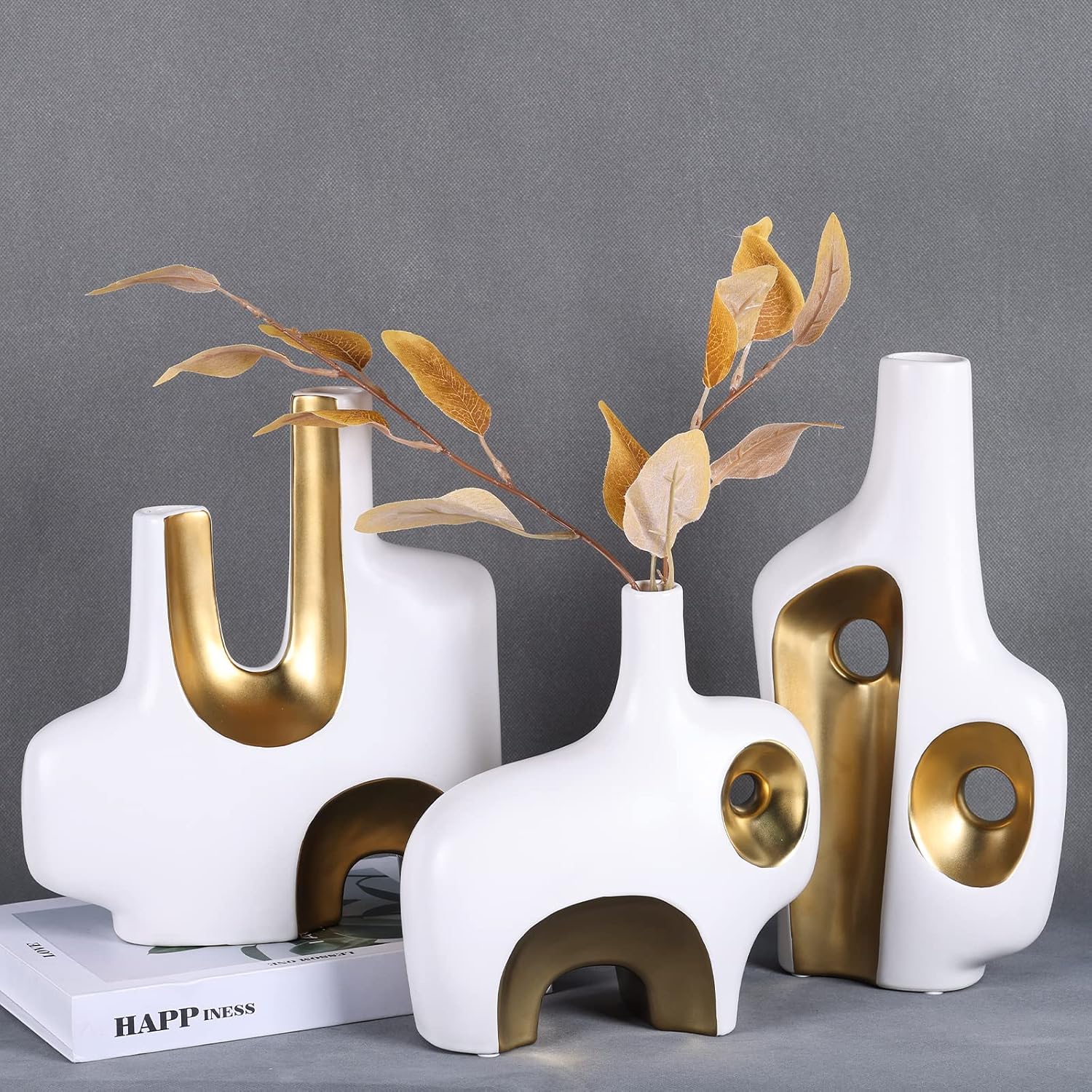 Abstract art vase set styled with pampas grass and roses in editorial setting