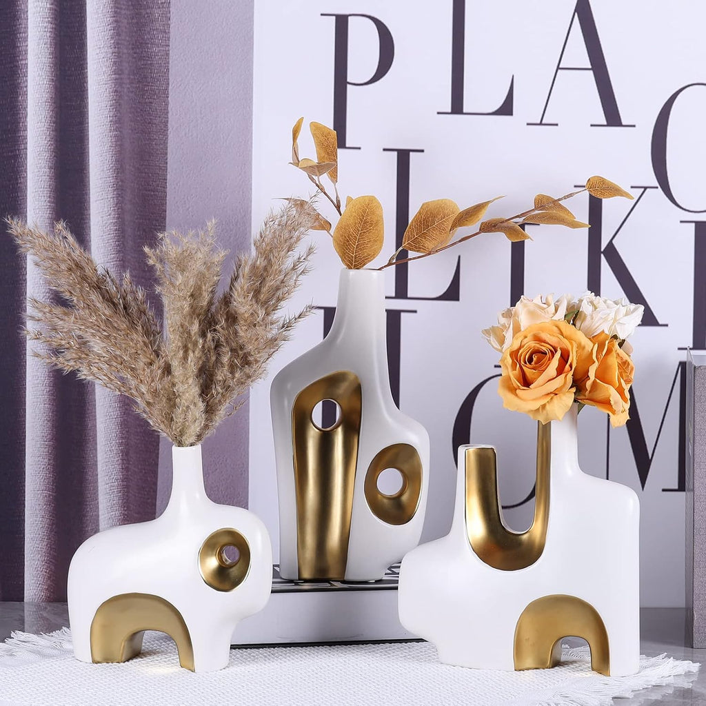 Abstract art vase set of 3 in white and gold – group display on grey background