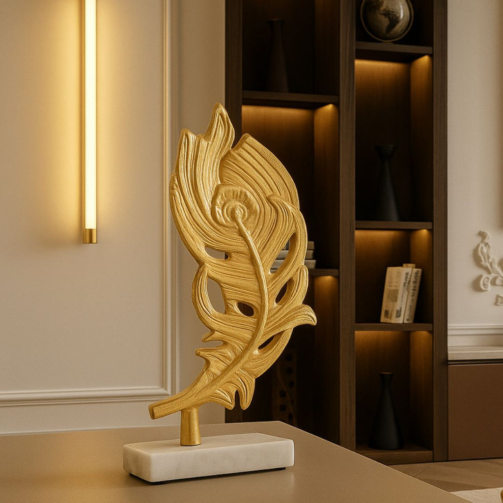 Gold peacock feather sculpture on marble base styled in luxury living room