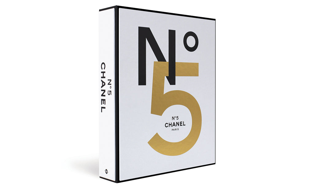 Chanel No 5 decorative coffee table book white cover with black and gold typography on white background
