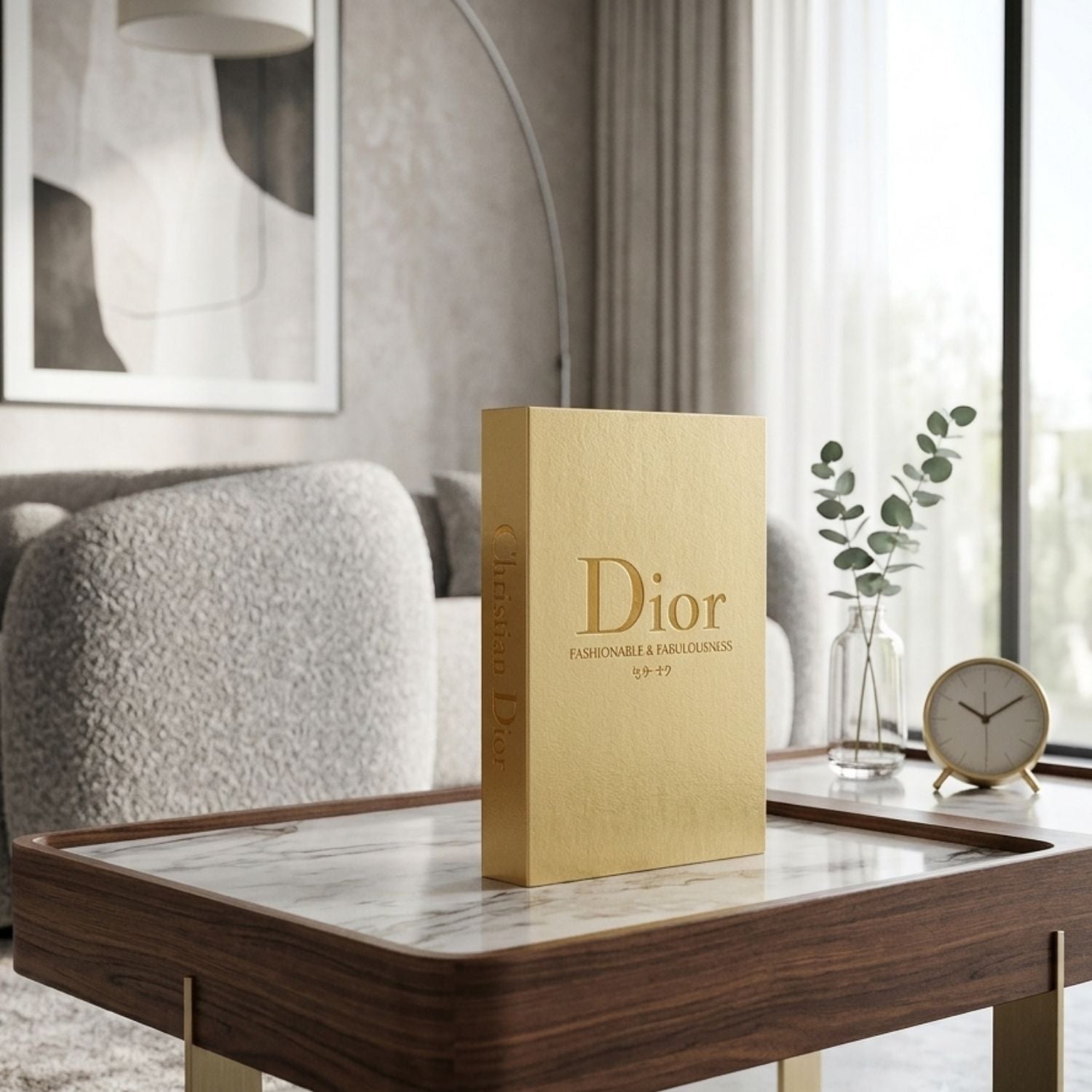 A gold-colored Dior Responsible & Sustainable book or folder stands on a wooden table in a modern living room setting.