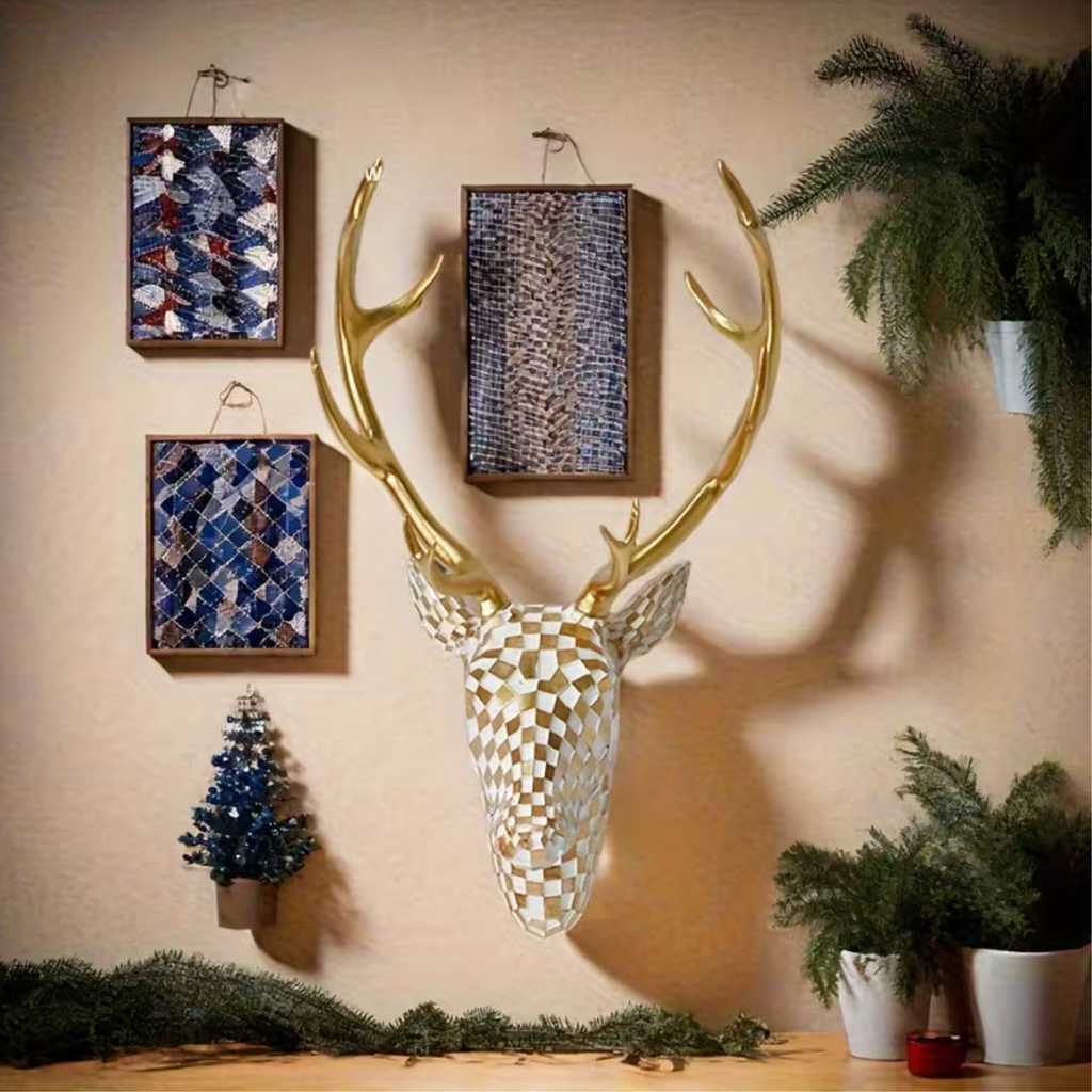 Gold antler stag head wall art styled in gallery wall with framed art