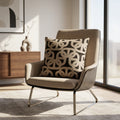 Charcoal black and brown chain link cushion styled on a neutral armchair