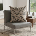 Grey cushion with cream-toned chain link pattern styled on a grey armchair