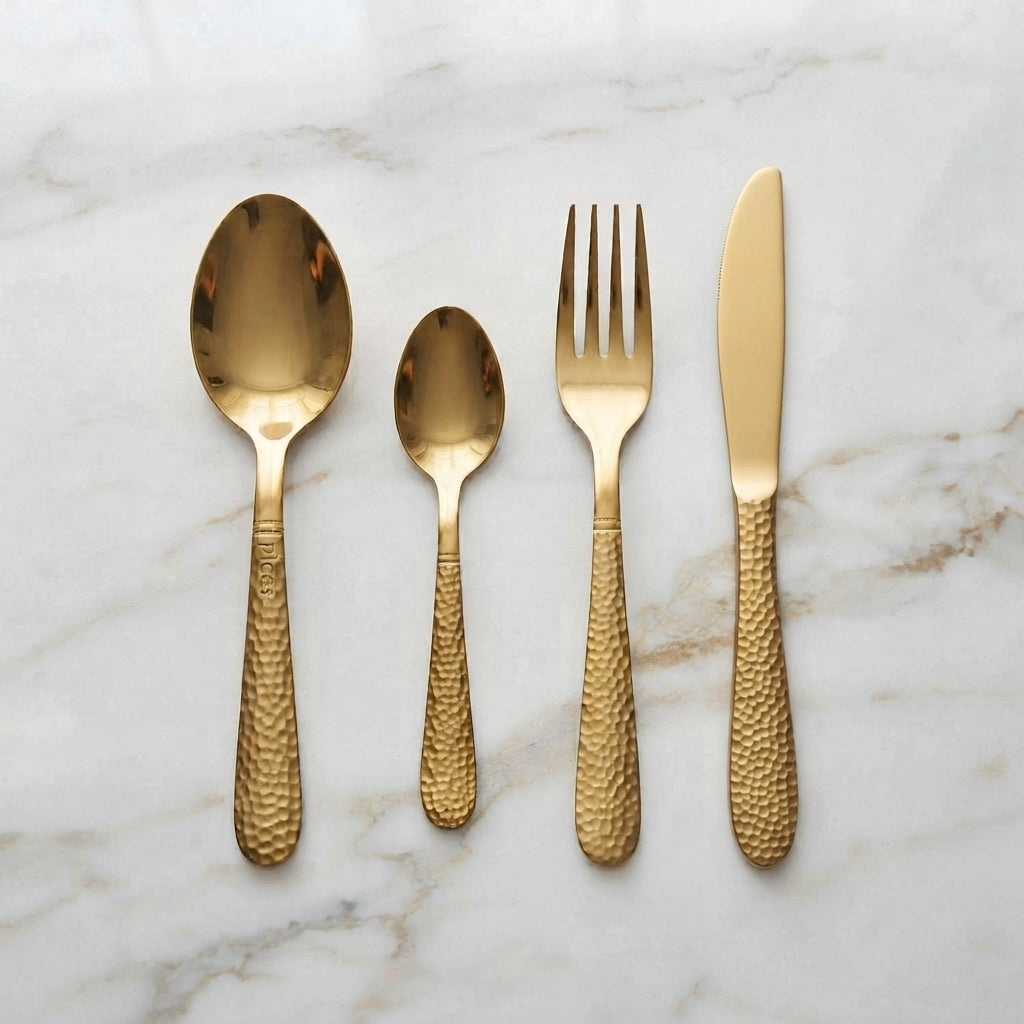 Gold Hammered Cutlery Set 24 Piece – styled on marble surface