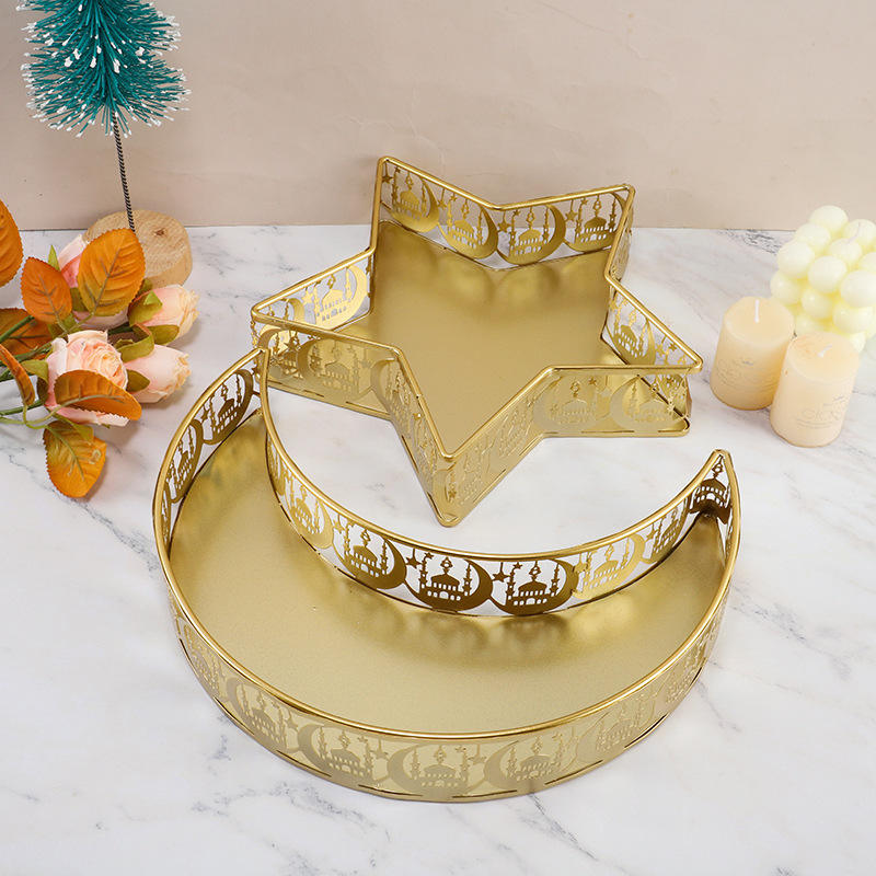 Gold star and crescent decorative tray set styled on a coffee table
