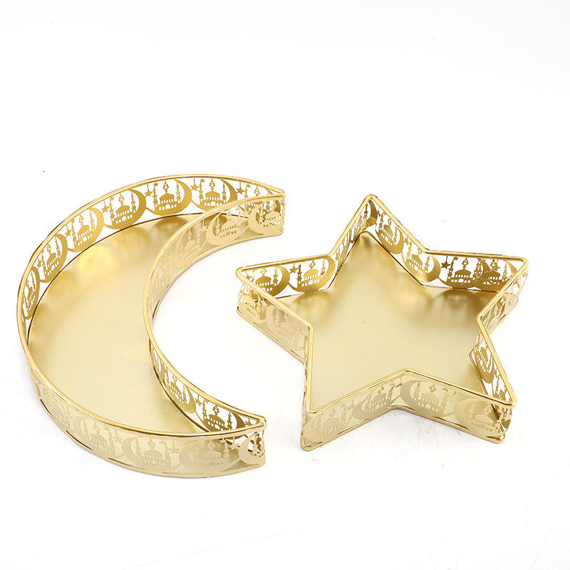 Gold star and crescent decorative tray set styled with candles and flowers