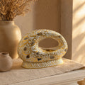 Arabic Calligraphy Oud Burner White and Gold 12x18.5cm – oval arch with gold script displayed on beige console with dried botanicals in warm sunlight