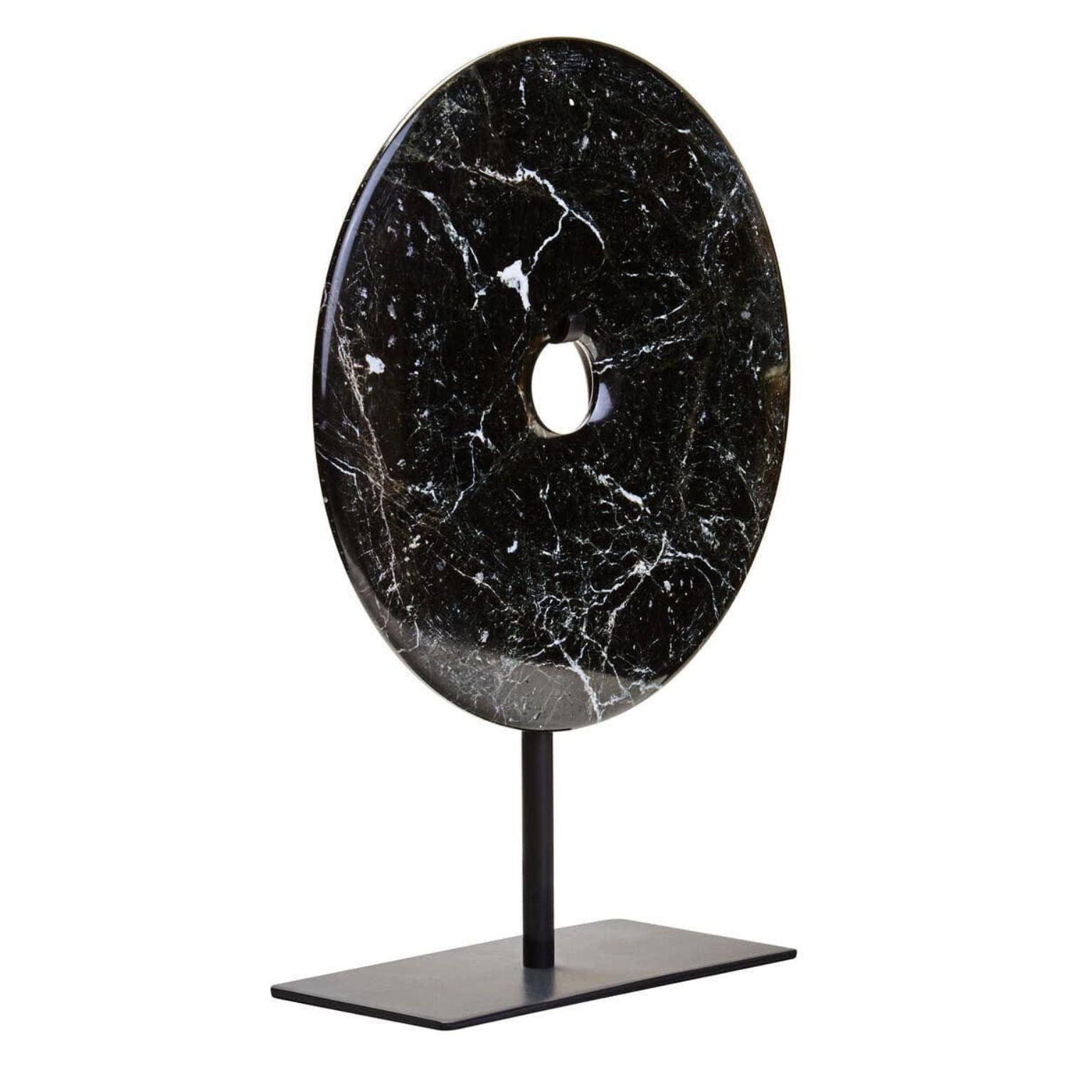 A black marble round wall plaque with a central hole, mounted on a black metal stand with a rectangular base, shown against a plain white background.