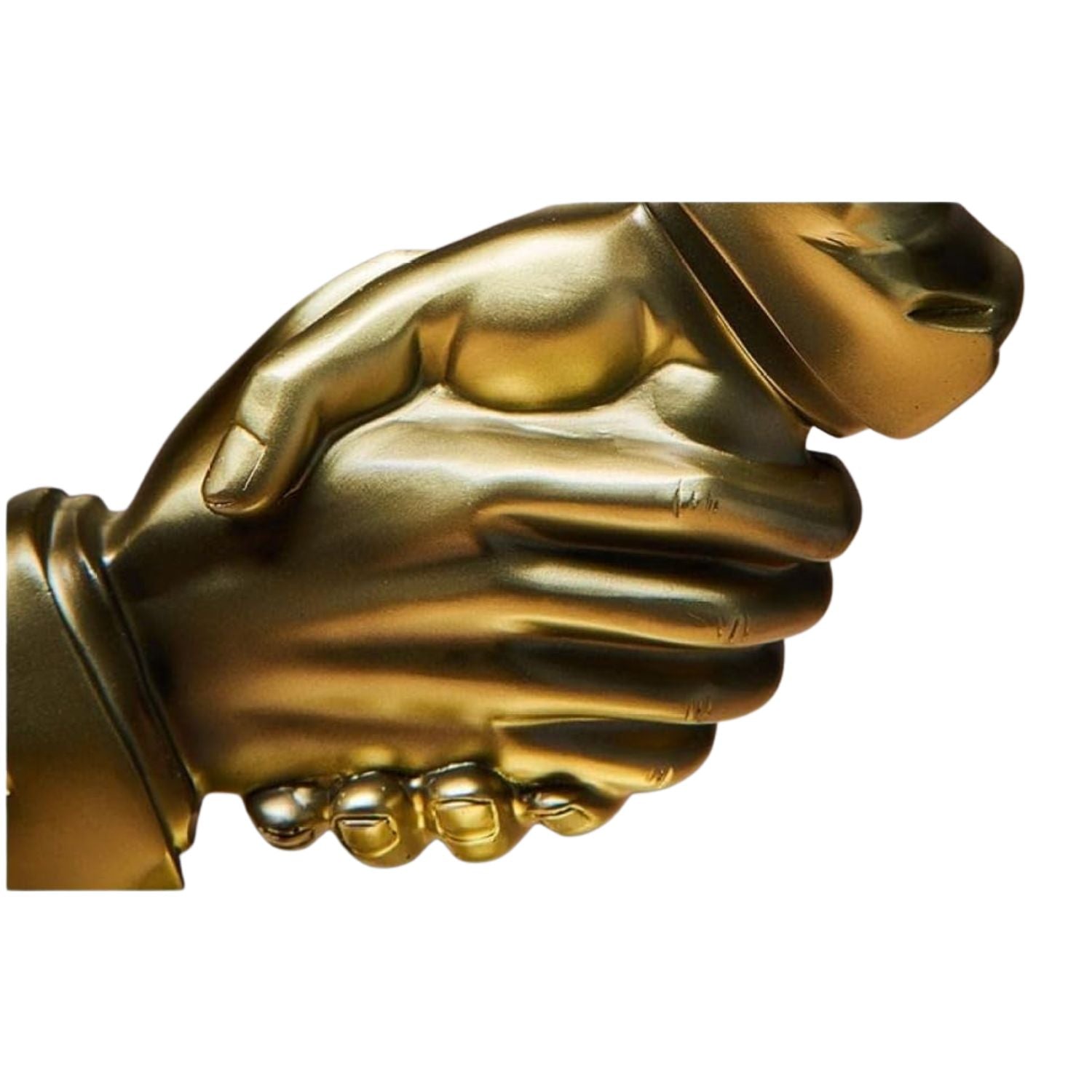 A close-up of a metallic gold sculpture depicting a handshake, with a stylized face emerging from behind the right hand, set against a plain white background.