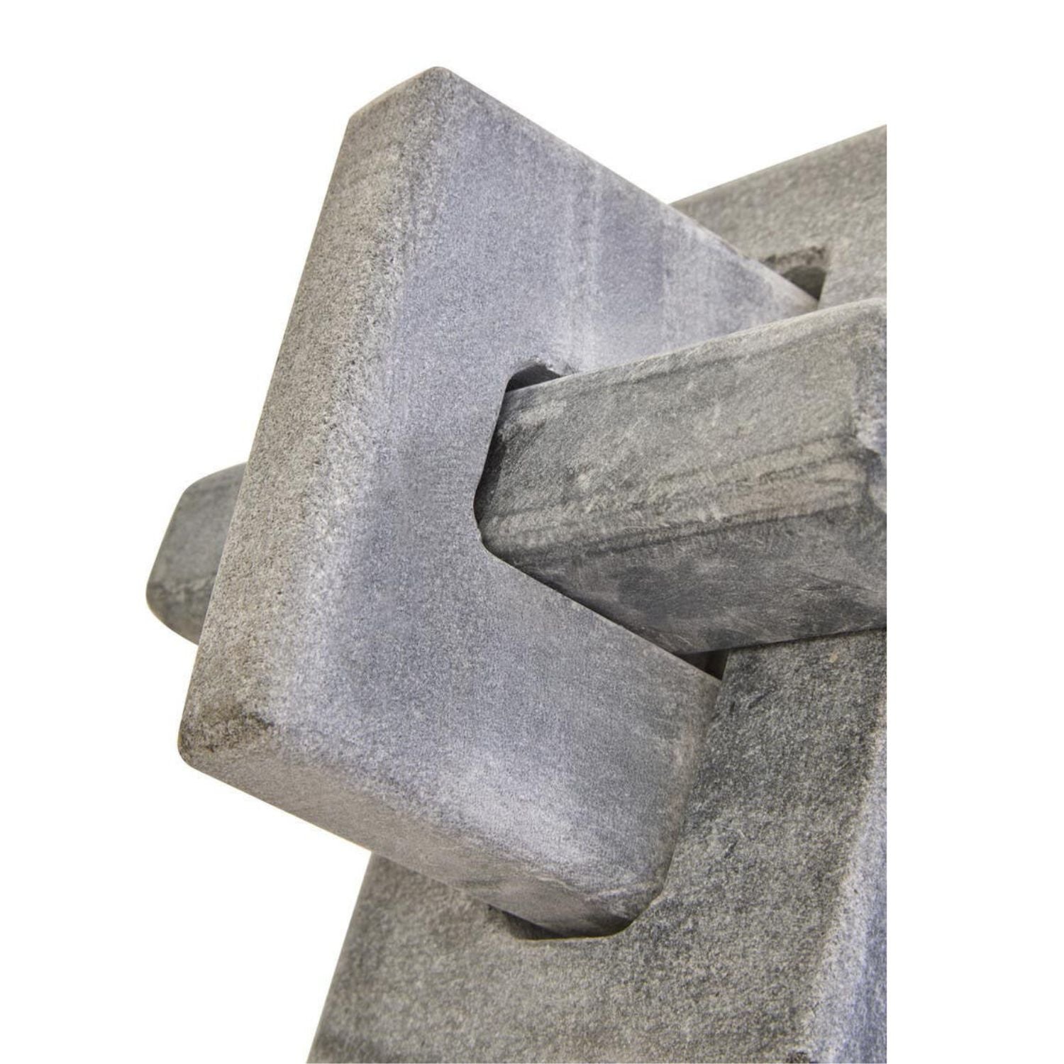 A close-up of a gray stone or concrete decorative wall feature with a textured, rough-hewn geometric design on a white background.