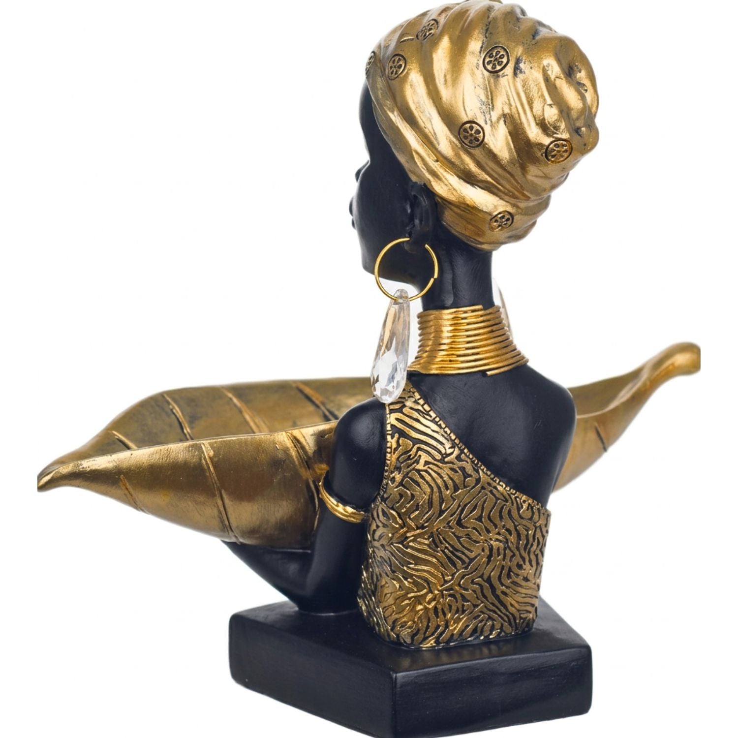 A decorative bust sculpture of a woman in profile, featuring a black body and base with ornate gold detailing on the headwrap, jewelry, and patterned garment, set against a plain white background.