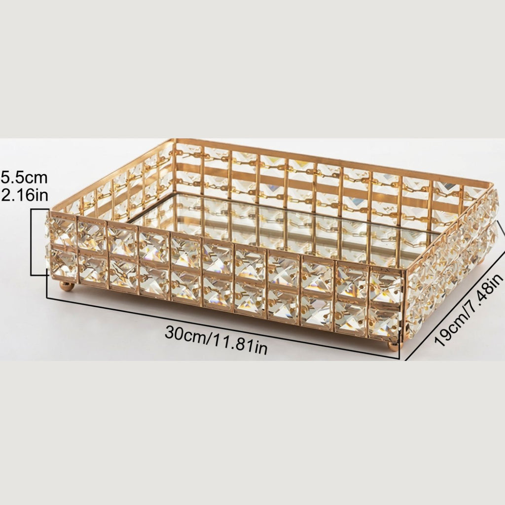 A rectangular gold-tone metal tray with clear faceted rhinestones, shown on a light gray background with black dimension lines and text indicating measurements of 30cm by 18cm by 5.5cm.