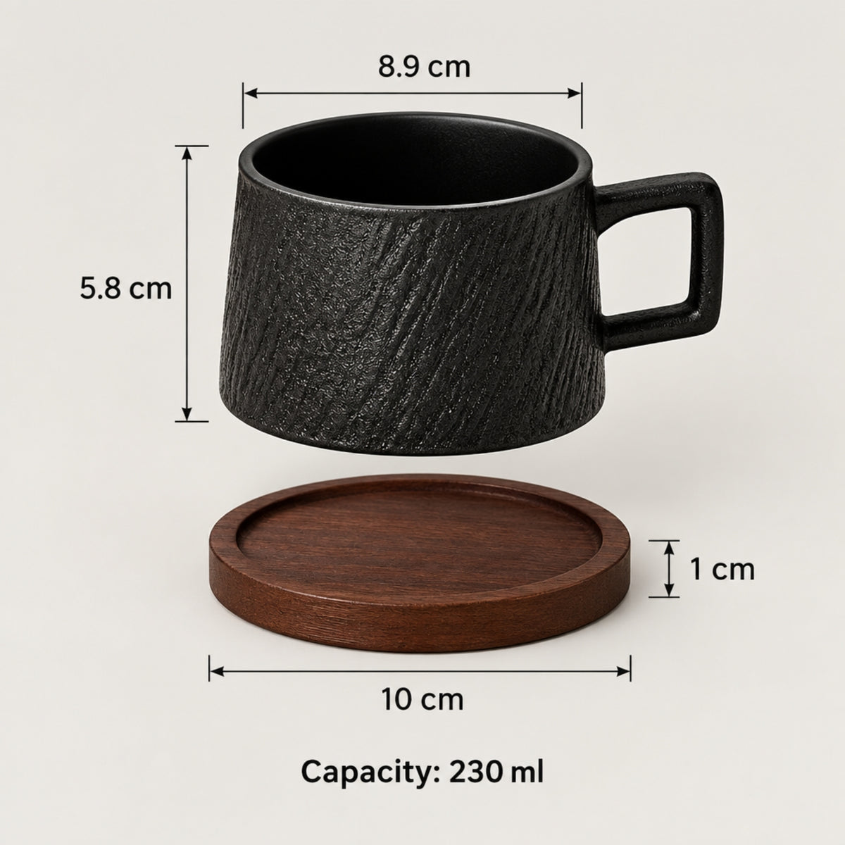 Black textured ceramic mug with a square handle and a matching round wooden coaster, shown with dimension labels (8.9 cm width, 5.