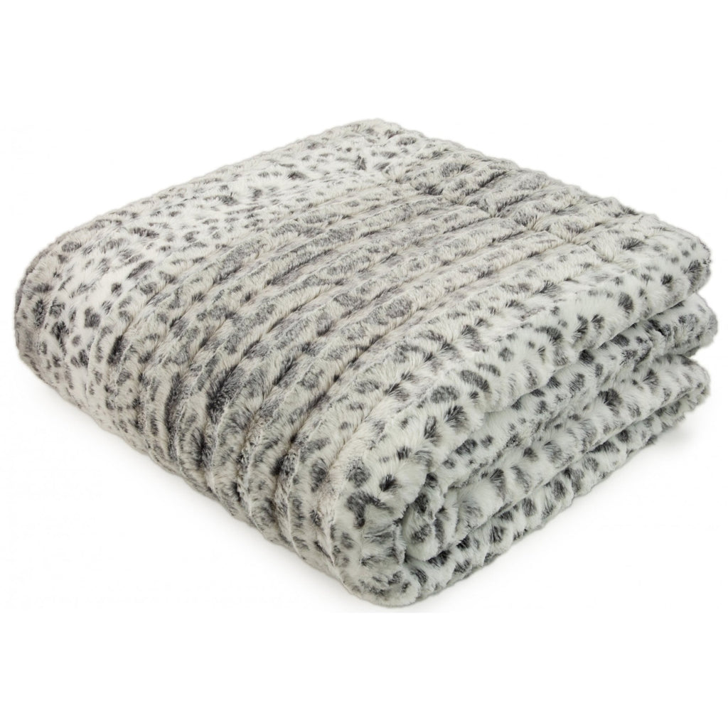 Folded blanket with a pattern on a white background