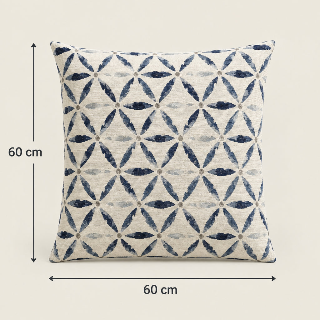A square throw pillow with a geometric interlocking leaf pattern in navy blue and light gray on an off-white background, shown with dimension arrows indicating 60 cm by 60 cm.