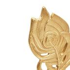 Close-up detail of gold peacock feather texture and swirl pattern