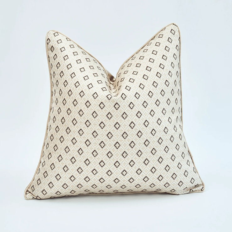 Close-up of beige cushion geometric jacquard pattern