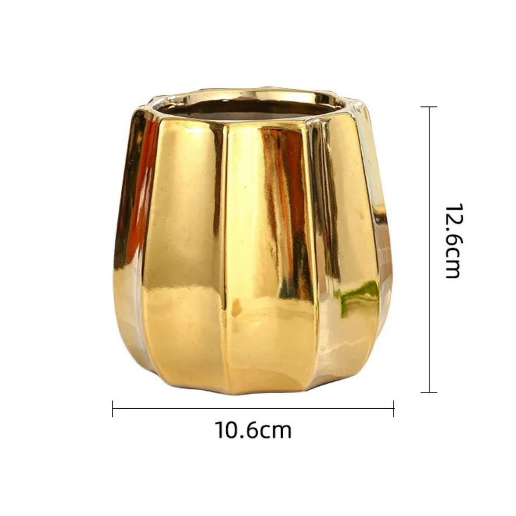 A shiny gold metallic planter pot with a fluted, ribbed design, shown with dimension lines indicating a height of 12.6cm and a width of 10.
