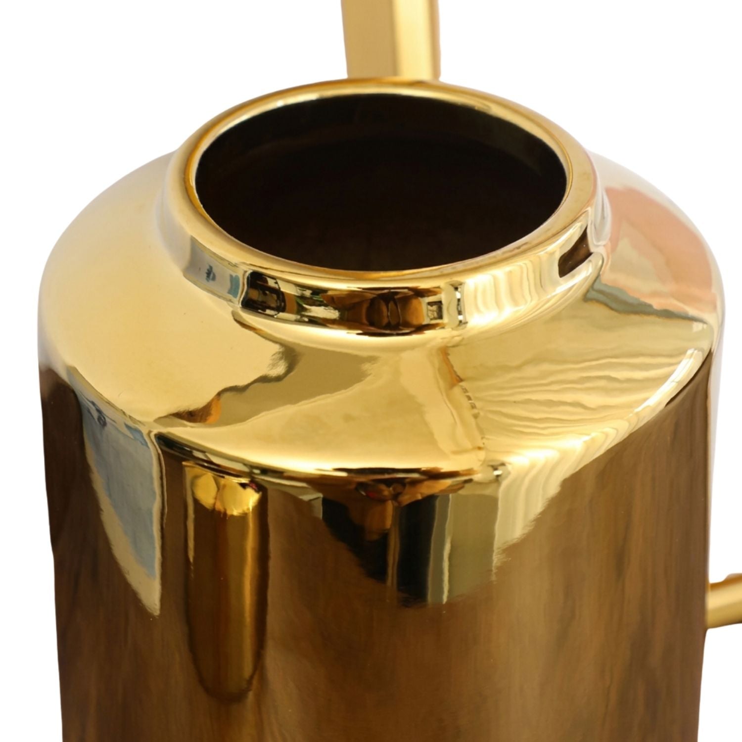 A close-up of a shiny metallic gold cylindrical container or vase with a wide open top, shown against a plain white background.