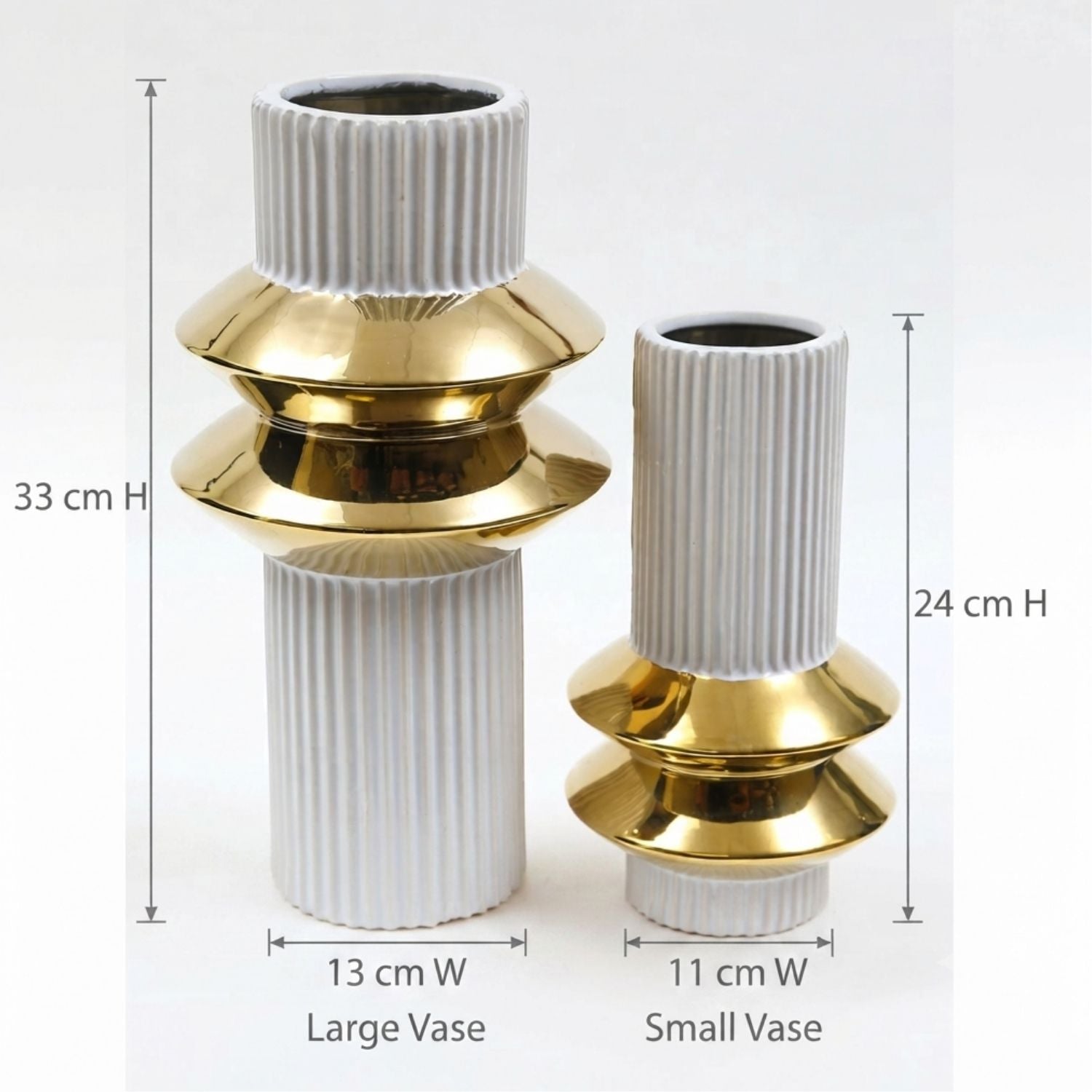 Two ribbed ceramic vases with shiny gold metallic flared bases, shown with height and width dimension labels: a large vase 33 cm high by 13 cm wide, and a small vase 24 cm high by 11 cm wide, on a white background.
