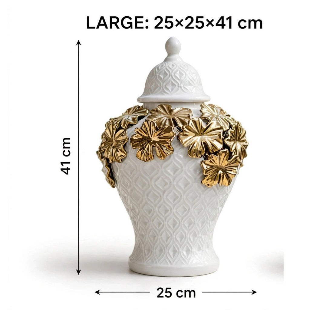 A white ceramic lidded jar or vase with embossed geometric patterns and gold-tone floral accents around the neck, shown with dimension arrows and text reading LARGE: 25x25x41 cm on a white background.