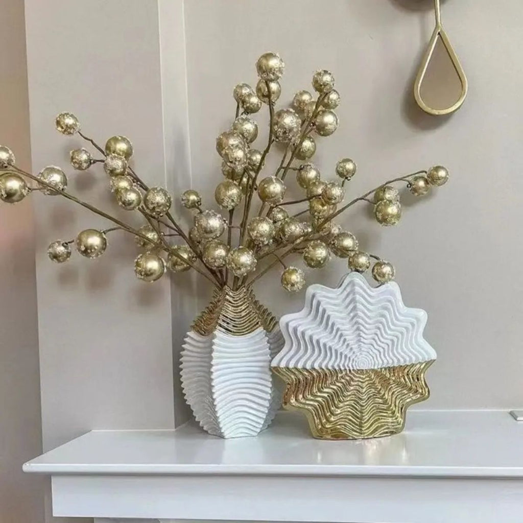 White and gold ceramic vase with large white peonies