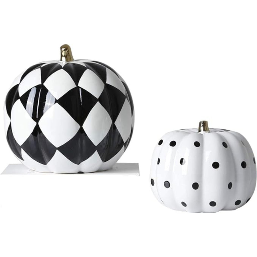 White pumpkin ornament with black polka dots showing 16 by 16 by 14 centimetre dimensions
