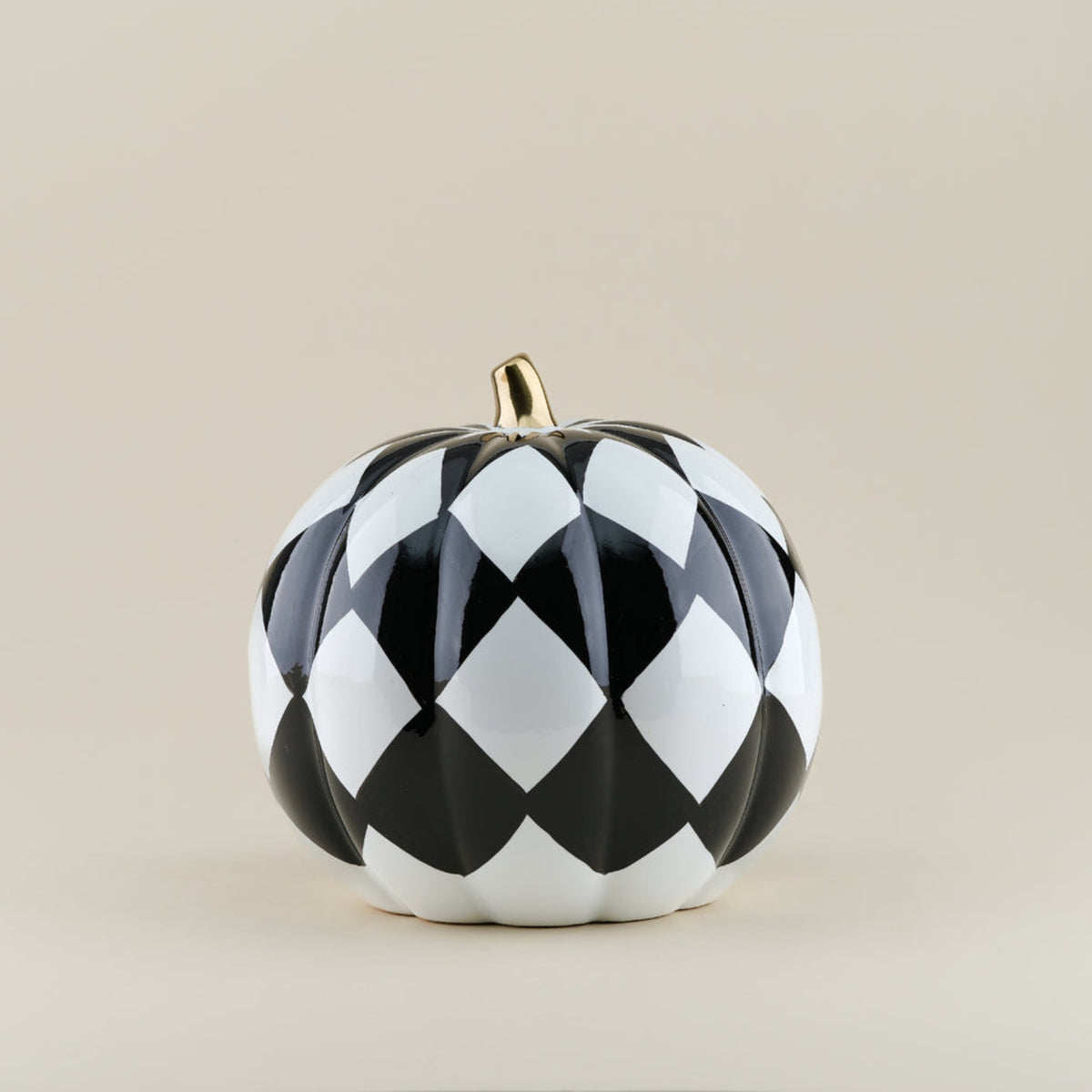 Black and white harlequin pumpkin ornament showing 21 by 21 by 20 centimetre dimensions
