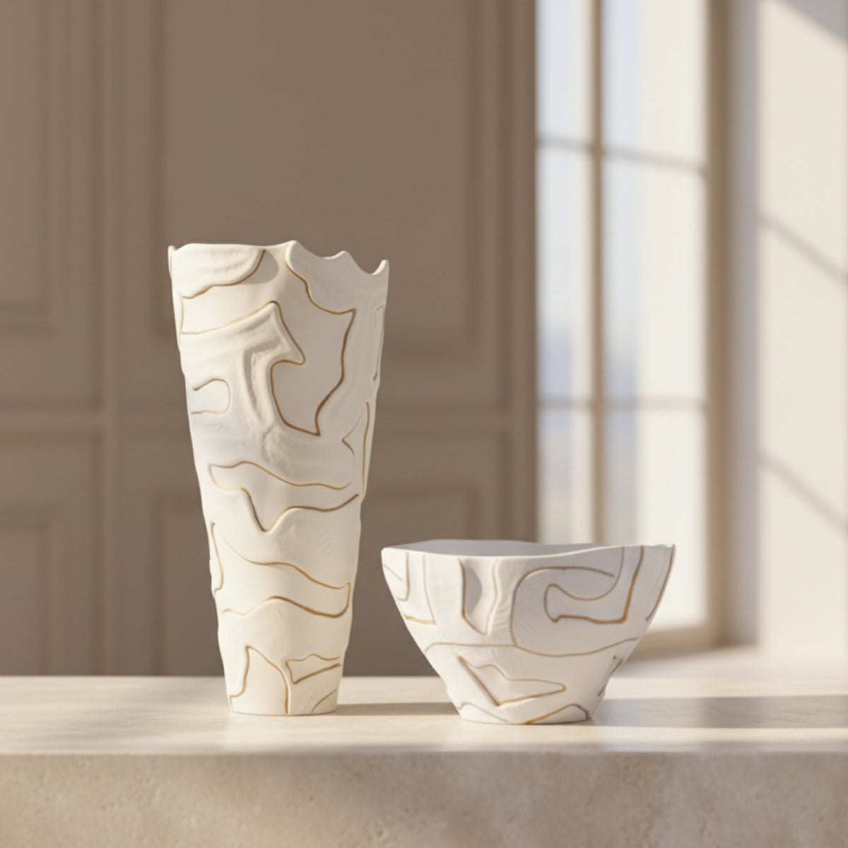 White abstract sculptural vase and bowl styled together