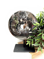 Toluca black marble disc sculpture on media console