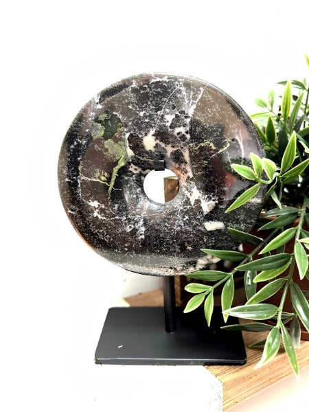 Toluca black marble disc sculpture on media console