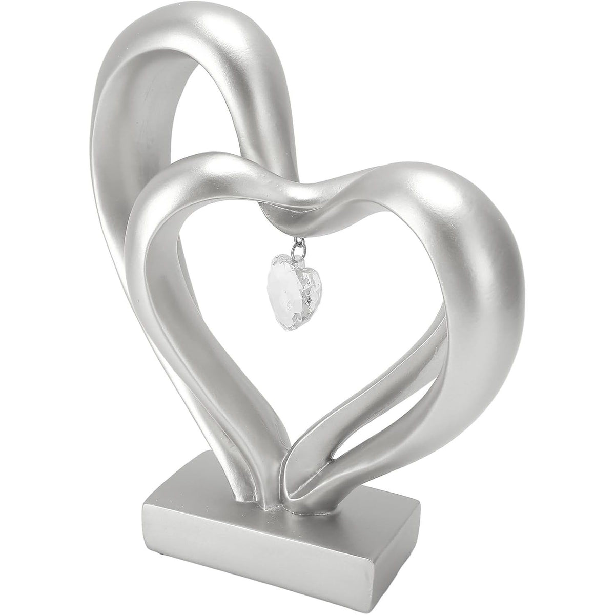 A silver-toned decorative heart sculpture with two interlocking heart shapes and a small clear heart pendant, displayed on a rectangular base against a plain white background.