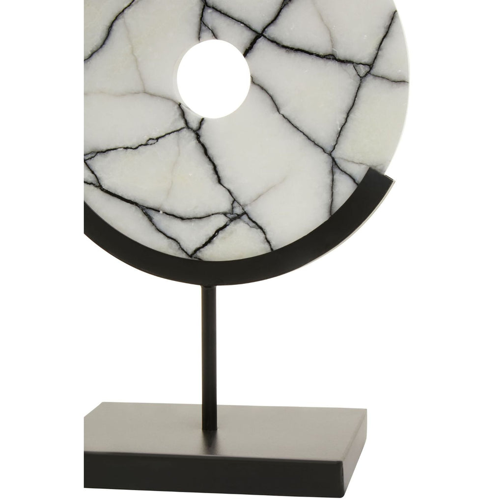 A modern table lamp featuring a circular white stone shade with black veining, supported by a matte black metal stand with a rectangular base, shown against a plain white background.