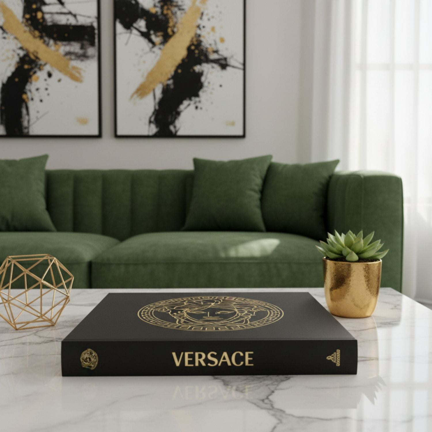 A black Versace decorative box with gold lettering and emblem, displayed on a white marble table in a modern living room setting with a green sofa and abstract wall art.